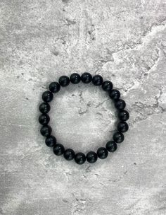 This Shungite Bracelet EMF is the perfect way to protect yourself from harmful electronic radiation. Shungite is a powerful stone known for its ability to absorb and neutralize negative energy, and this bracelet is made with an especially high concentration of Shungite to provide maximum protection. Black Bracelets With 8mm Beads For Healing, Black Crystal Bracelet With 8mm Beads For Healing, Black Hematite Crystal Bracelet For Spiritual Use, Black Obsidian Stretch Bracelet With Round Beads, Black Hematite Crystal Bracelet Spiritual, Black Hematite Spiritual Crystal Bracelet, Black 8mm Beads Bracelets For Meditation, Black Spiritual Hematite Crystal Bracelet, Black Bracelets With 8mm Beads For Meditation