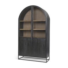 an arched bookcase with two shelves on one side and a door to the other