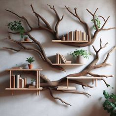 three bookshelves are arranged in the shape of a tree with branches on them