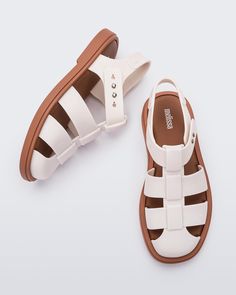 Ever an icon, the Emma sandal takes design inspiration from classic fisherman sandals with contemporary style and comfort. Take on the trend with wide interwoven straps, a matte finish and a rounded toe. Plus, a soft insole and adjustable pin closure keep them comfortable and secure wherever your day takes you. Modern Flat Jelly Sandals For Summer, Modern Jelly Sandals With Round Toe For Beach, Modern Adjustable Flat Sandals, Casual Leather Jelly Sandals For Beach, Synthetic Jelly Sandals With Adjustable Strap And Round Toe, Casual Leather Jelly Sandals With Round Toe, Modern Flat Jelly Sandals For Beach, Modern Sandals With Woven Sole And Round Toe, Modern Slingback Sandals With Textured Footbed For Beach