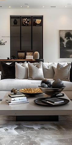 a living room filled with lots of furniture next to a white couch and coffee table