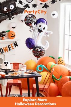 halloween decorations and balloons are on display in the dining room