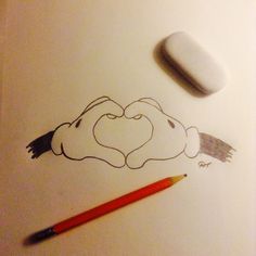 a pencil and eraser next to a drawing of a heart in the shape of a cloud