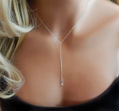 "Lariat Cubic Zirconia Y Necklace Add a Touch of Sparkle to your outfit with this super cute, radiant, delicate clear cubic zirconia necklace. This cz pendant is complete with a high polished, 14K Gold Filled or Sterling Silver Chain. Great everyday look! IT'S IN THE DETAILS * 14K Gold Filled, Sterling Silver - * Gold, Silver Rectangle CZ - approx. 1/2\" Photo #1 - Shown with a 17\" necklace plus a 3\" drop (total drop with chain plus cz) Photo #3 - Earrings shown at 2 1/2\" To View More Lariat Dainty Jewelry With Adjustable Length For Party, Adjustable Delicate Backdrop Necklace For Party, Long Drop Backdrop Necklace For Party, Silver Lariat Necklace With Delicate Chain For Party, Adjustable Delicate Chain Lariat Necklace For Party, Adjustable Delicate Lariat Necklace For Party, Elegant Adjustable Teardrop Pendant Jewelry, Dainty Lariat Backdrop Necklace For Party, Sterling Silver Lariat Jewelry For Party