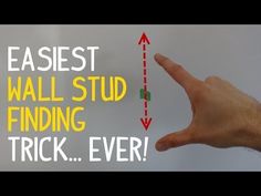 a hand is pointing at a wall with the words easyest wall stud finding trick ever