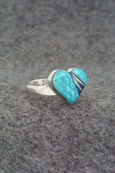 This turquoise, onyx, opalite and sterling silver inlay ring was made by Navajo silversmith Michelle Willie. The inside of the band is signed and stamped .925.Size: 8 adjustableLength: 1/2"Width: 5/8"Free shipping on all orders! We ship with USPS and always include tracking. All orders ship within a day of payment.Returns are accepted up to 30 days after you receive your order. Just send us a message. Our shop offers cash back or store credit. The item must be returned in the same condition. Sterling Silver Turquoise Ring With Polished Finish For Anniversary, Artisan Rings With Inlay For Anniversary, Adjustable Turquoise Ring With Inlay For Gift, Blue Opal Inlay Ring For Anniversary, Blue Opal Ring With Inlay For Anniversary, Anniversary Blue Opal Ring With Inlay, Gift Open Ring With Inlay, Sterling Silver Inlay Ring, Sterling Silver Inlay Ring For Anniversary