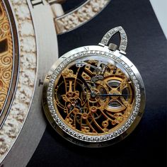 A vintage and rare Audemars Piguet skeletonized watch in 18k white gold, crafted during the 1970s. The 47.3 mm case features black enamel Roman numeral hour markers on the satin-finish bezel and is flanked by 60 diamonds, and the tapered bow contains 9 diamonds. The decorative engraving of the gold movement is fully seen on either sides; truly a masterpiece created by Audemars Piguet consisting of hours of meticulous craftsmanship in the openwork technique, simply complemented by blued-steel feu Luxury Collectible Quartz Jewelry And Watches, Luxury Collectible Watches, Timeless Jewelry And Watches With Skeleton Dial, Elegant Watch Accessories With Rotating Bezel As Gift, Timeless Round Skeleton Dial Jewelry And Watches, Timeless Round Watches With Skeleton Dial, Timeless Round Skeleton Dial Watches, Timeless Round Jewelry With Skeleton Dial, Timeless Collectible Watches With Skeleton Dial