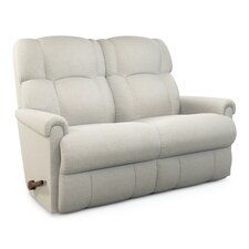 the reclining loveseat is upholstered and ready to be used as a sofa