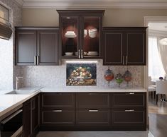 a kitchen with brown cabinets and white counter tops