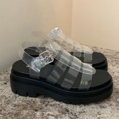 Nwt Comes With Box! Size Us 6.5 Which Is A Eu 37 Pretty Comfy Shoes! Chunky Shoe Style! Transparent / Translucent Appearance Plastic Used For That! Base Is Platform Sandal That Is Black And Firm Yet Comfy! Came Brand New With All Tags, I Had To Remove One Of The Buckle Tags So I Could Model It! Sorry!! By A Brand Called Call It Spring More Like Call It Summer!!! Amazing For The Beach And Cute Summer Fits! Trendy Jelly Sandals With Transparent Straps, Clear Synthetic Jelly Sandals With Transparent Straps, Round Toe Jelly Sandals With Transparent Straps, Modern Platform Jelly Sandals With Round Toe, Trendy Clear Sandals With Translucent Outsole, Clear Jelly Sandals With Transparent Straps And Round Toe, Clear Sandals With Round Toe And Clear Strap, Synthetic Jelly Sandals With Transparent Straps, Clear Jelly Sandals With Round Toe And Transparent Straps