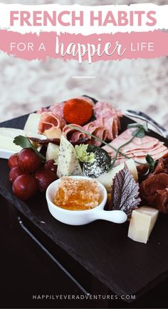 a plate full of meats and cheese with the words french habitts for a happy life