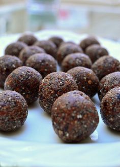 chocolate energy bites on a white plate with the words thermomix above them