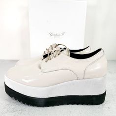 Nwt Giordana F. Patent Leather Ivory White Derby Wedge Shoes 7.5 Chunky Platform - Made In Italy - Derby Style - Patent Leather - Platform - Serrated Sole - Lace Up - Round Toe - Brand New With Box. Store Shelf Condition, Noted Dust Outsoles See Photos Overall Its Very Good Condition. High Quality Made. Retail $375.00 Size: Eu 38 - Us 7.5 Colorway: White Ivory Elegant White Heels With Rubber Sole, White Leather Round Toe Wedge Sneakers, White Wedge Sneakers With Platform, Modern White Wedge Sneakers, Modern White Leather Wedge Sneakers, White Wedge Sneakers With Contrast Sole And Round Toe, White Wedge Sneakers With Contrast Sole, White Flat Heels With Rubber Sole, White Formal Heels With Rubber Sole