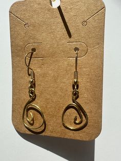 handmade dangly spiral earrings. these are also wire wrapped and can have a bead added to the bottom if you wish. let me know if you have any questions or requests! Gold Silver-plated Earrings As Gift, Gold Silver-plated Earrings For Gifts, Spiral Metal Earrings With Ear Wire, Gold Silver-plated Wire Earrings As Gift, Metal Spiral Earrings With Ear Wire, Gold Silver-plated Wire Earrings For Gift, Wire Wrapped Swirl Earrings As Gift, Wire Wrapped Swirl Earrings For Gift, Spiral Wire Earrings With Ear Wire