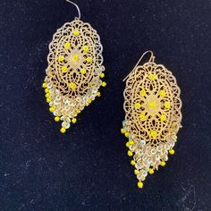 Gold Filigree Metal Earrings With Yellow Tiny Beads. Fringed Hung Cluster Of Yellow Beading Fish Hook For Pierced Ears Elegant Yellow Beaded Earrings With Gold Beads, Elegant Yellow Beaded Dangle Earrings, Party Yellow Pierced Jewelry, Yellow Dangling Beads Earrings For Party, Bohemian Chandelier Earrings With Gold Beads For Party, Bohemian Gold Beaded Chandelier Earrings For Party, Yellow Pierced Earrings For Party, Yellow Bohemian Earrings For Festive Occasions, Gold Bohemian Beaded Pierced Earrings