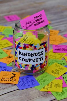 a jar filled with lots of colorful sticky notes