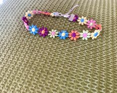 The Honey Kids Floral Choker is a dainty, floral accent choker. Recommended for children 3 years and older. **Please select the age of child in the notes section of check out to receive a custom size** For Children 3-6 years old 6.5 inches with 3 inch chain extension For Kids 7 - 12 y/o 8 inches with 3 inch extension 13 and older- Adult size choker 12 inches Kids Flower Necklace, Kids Flower Choker, Kids Choker, Kids Choker Necklace, Kids Flower Necklace, Kids Necklace, Kids Jewelry, For kids Adjustable Pink Flower Necklace, Adjustable Multicolor Flower Necklace For Spring, Multicolor Flower Necklace For Spring Gift, Adjustable Flower Necklace With Flower Decoration, Multicolor Flower Necklace As Spring Gift, Spring Multicolor Adjustable Flower Necklace, Spring Multicolor Flower Necklace As Gift, Cute Adjustable Flower Charm Necklace, Cute Adjustable Flower Necklace For Gifts