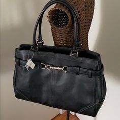 Black Leather Coach Bag, New With Tags. Footed Bottom. Silvertone Buckle Hardware On Front Of Bag. Zipper Top To Close. Inside, One Zippered Pocket And Two Slip Pockets. Black Fabric Lining. Very Roomy Interior. Tassel Detail. 13.5” Wide, 10” High, 5.5” Wide, 8.5” Handle Drop. Coach Vintage Handbags Worth, Coach Work Bags For Women, Cheap Coach Bags Brixton Baker, Coach Bags Handbags 2022, Coach Retro Bags, Luxury Coach Saddle Bag With Main Compartment, Coach Bags Handbags Coach, 2001 Coach Purse Value, Coach Purse Coach