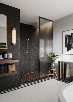 a bathroom with black and white walls, a gold framed mirror, an open shower stall and a plant in a pot