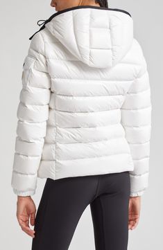 Whether you're headed somewhere metropolitan or mountainous, you'll stay warm in this sporty down puffer made from Moncler's water-resistant lacquered nylon. Elasticized cuffs and a detachable drawcord hood provide extra protection from the elements. Two-way front-zip closure Stand collar; removable drawcord hood Elastic cuffs with adjustable snap tab Front zip pockets; sleeve snap-flap pocket Lined, with down fill 100% polyamide Dry clean or machine wash, line dry Imported Designer Clothing Fitted Nylon Puffer Jacket For Outdoor Activities, White Sporty Quilted Outerwear, Sporty White Quilted Outerwear, White Nylon Puffer Jacket With Detachable Hood, Sporty Quilted Down Puffer Jacket, Sporty Weatherproof Down Puffer Jacket, Sporty Waterproof Down Puffer Jacket, White Nylon Puffer Jacket With Padded Collar, White Sporty Puffer Jacket With Padded Collar