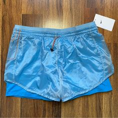 Nike Shorts Size: Xl Ships Same Day Or Next! Nike Blue Nylon Bottoms, Nike Nylon Beach Bottoms, Nike Orange Short Bottoms, Nike Orange Shorts, Light Blue Nylon Bottoms For Summer, Grey Nike Shorts, Nike Running Shirt, Nike Tempo Shorts, Black Nike Shorts