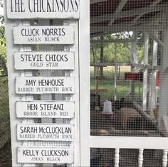 there are many signs posted on the side of this building that read, the chickens