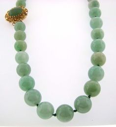 "Jadeite Bead necklace; fastened with a 14K Yellow Gold Filigree clasp set with an oval jadeite cabochon.   41 Jadeite beads : Measurements: Average 11.07 MM.  The Oval Jadeite in clasp: 13.92 x 11.73 MM.  Length closed: 20\"." Oval Jade Gemstone Beads Jewelry, Elegant Single Strand Round Beads, Formal Jade Jewelry With Round Beads, Elegant Round Aventurine Jewelry, Vintage Jade Jewelry Hand-strung, Vintage Hand-strung Jade Jewelry, Classic Jade Gemstone Beads Jewelry, Elegant Round Chrysoprase Necklaces, Elegant Chrysoprase Gemstone Beads Necklaces