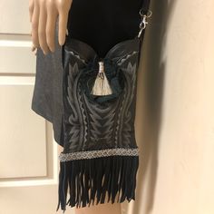 Here Is A Gorgeous Unique Handbag By Dan Post. Features A Leather Exterior With A Tassel In The Center And Suede Fringes At The Bottom. The Long Removable Shoulder Strap Allows Comfortable Wear All Day Long. Condition: Good. Light Wear, Inside Is Clean. Measurements Are: 6” L X 9.5” H X 2” D. Strap Drop 26” No Trades Or Low Ball Offers Chic Black Bag With Fringe, Black Fringe Shoulder Bag For Daily Use, Black Tassel Crossbody Bag, Black Leather Fringe Bags, Daily-use Brown Bag With Fringe, Dan Post Boots, Unique Handbag, Suede Fringe, Black Leather Handbags