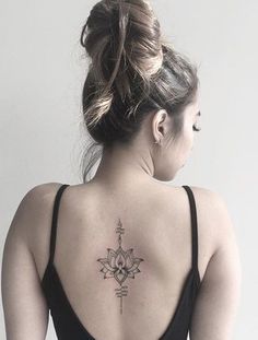 a woman with a tattoo on her back