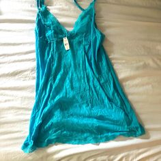 Cute Cami For Bed Lounging Blue V-neck Camisole For Loungewear, Victoria's Secret Blue V-neck Sleepwear, Blue V-neck Camisole For Daywear, Blue Sleepwear With Built-in Bra For Summer, Blue Sleeveless Sleepwear With Built-in Bra, Blue Camisole With Spaghetti Straps For Loungewear, Blue Spaghetti Strap Camisole For Loungewear, Blue Sleepwear With Built-in Bra For Loungewear, Blue Camisole For Daywear