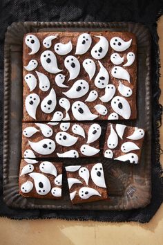 halloween brownies decorated with white icing and ghost faces