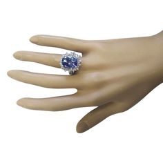 Stamped: 14K White GoldTotal Ring Weight: 8.9 GramsRing Length: N/ARing Width: N/AGemstone Weight: Total Natural Tanzanite Weight is 9.30 Carat (Measures: 13.80x10.15 mm)Color: BlueDiamond Weight: Total Natural Diamond Weight is 1.00 CaratColor: F-G, Clarity: VS2-SI1Face Measures: 19.77x18.15 mmSku: [703446W] Formal Tanzanite Ring In Fine Jewelry Style, Tanzanite Rings With 17 Jewels For Anniversary, Formal Tanzanite Multi-stone Diamond Ring, Formal Multi-stone Tanzanite Diamond Ring, Formal Tanzanite Sapphire Ring, Formal Sapphire Multi-stone Topaz Ring, Formal Tanzanite Ring Jewelry, Formal Tanzanite Sapphire Ring With Multi-stone, 14k White Gold Diamond Ring