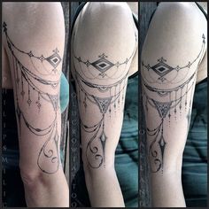 a woman's leg with tattoos on it and an image of a dream catcher