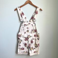 Brand: Bdg (Urban Outfitters) Size: Small Color: White Floral Material: 98% Cotton; 2% Spandex Condition: Never Worn; No Rips Or Stains Attributes: Machine Washable; Cute Buttons; Stretchy Measurements: Waist To End Of Cuffs Is 11.5" Summer Cotton Shortalls For Day Out, Casual White Cotton Shortalls, Trendy Shortalls For Spring Day Out, White Spring Shortalls Overall, Summer Floral Print Bottoms By Urban Outfitters, Urban Outfitters Floral Print Bottoms For Spring, Cotton Summer Shortalls For Spring, Trendy White Overall Bottoms, White Casual Shortalls For Summer