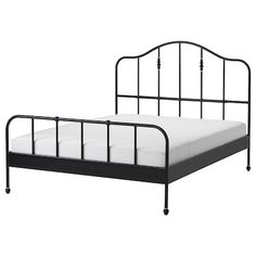 a black metal bed frame with white sheets and pillows on the bottom, against a white background