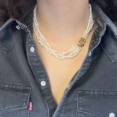 This 1980's Paloma Picasso for T&Co is a design from her earlier years at the esteemed jewelry house - a triple strand of pearls joined together by the most chic 18kt gold clasp situation! While pearls are certainly having a moment in style at the moment, they are a classic jewelry box staple that has the ability to make any outfit fabulous. We love the layered look that this necklace achieves, and that chunky and charming gold clasp makes a perfect adornment to be worn front and center (or side Gold Pearl Jewelry Necklace Tiffany & Co., Modern Mens Rings, Strand Of Pearls, Art Jewelry Earrings, Paloma Picasso, Jewel Necklace, Antique Watches, Antique Engagement, Vintage Band