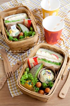 two baskets filled with food sitting on top of a table