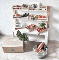 an assortment of fruits and vegetables sitting on a table