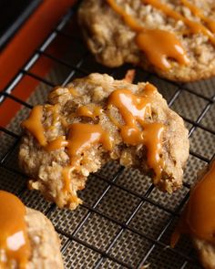 cookies with caramel sauce are cooling on a rack