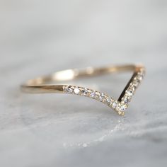 a gold ring with diamonds on it