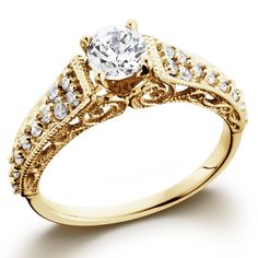 a yellow gold engagement ring with an old - fashioned design and round diamond center stone