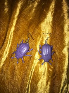 Cute light weight purple beetle bug toy drop earrings! Novelty Purple Earrings For Party, Cheap Retro Purple Earrings, Purple Beetle, Vintage Purple Drop Earrings, Different Bugs Jewelry, Beetle Earring, Bug Toys, Beetle Bug, Wellness Design