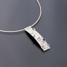 Modern Long Drop Gemstone Jewelry, Modern Sterling Silver Necklace With Bezel Setting, Modern Jewelry With Large Rectangular Pendant, Modern Sterling Silver Jewelry With Rectangular Pendant, Modern Pendant Necklace With Unique Variations, Modern Cabochon Necklaces For Gifts, Modern Jewelry With Round Cabochon Pendant, Modern Pendant Jewelry With Bezel Setting, Modern Silver Necklace With Bezel Setting