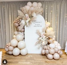 balloons and flowers decorate the backdrop for a wedding ceremony at crown's showroom