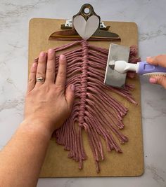 a person is cutting meat on a cutting board with a pair of scissors next to it