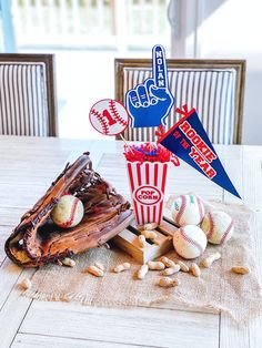 a table topped with baseballs and other items