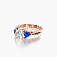 a diamond and blue sapphire engagement ring