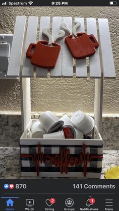 two red and white trays sitting on top of a counter next to a yellow flower