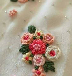 an embroidered fabric with flowers on it