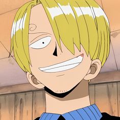 an anime character with blonde hair and blue shirt smiling at the camera while wearing a black sweater